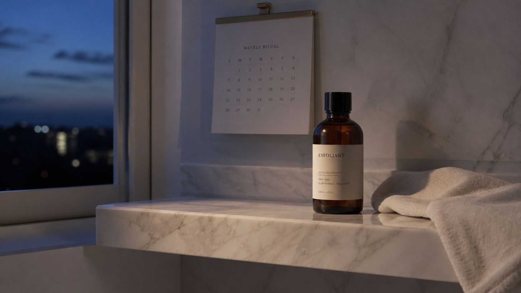 A brown glass bottle of gentle exfoliating treatment sits on a marble bathroom counter with a calendar.